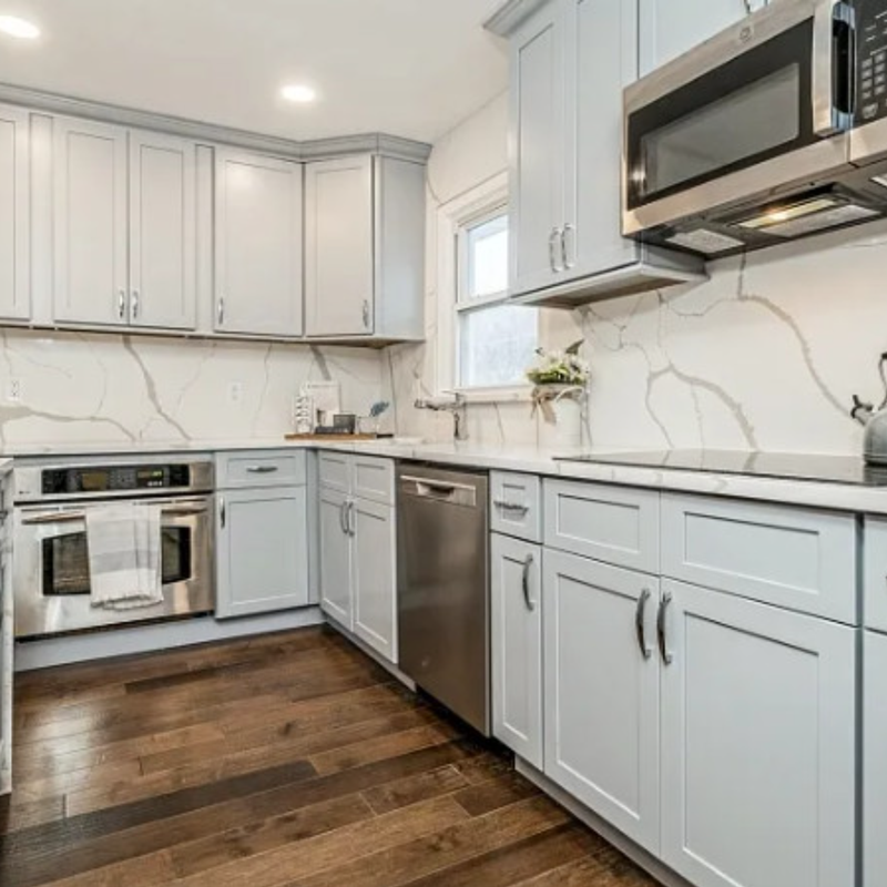 Flooring installation in a lake house kitchen and bathroom by Best Carpets & Interiors